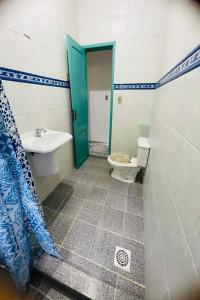 a bathroom with a sink and a toilet at Pousada e Hostel Vida no Paraiso in Angra dos Reis