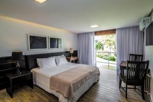 Cama ou camas em um quarto em Grande Hotel Canela