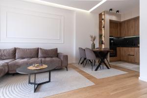a living room with a couch and a table at City Luxury in Trebinje