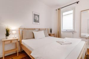 Postel nebo postele na pokoji v ubytování Old Town Center Apartments