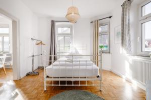 Postel nebo postele na pokoji v ubytování Old Town Center Apartments