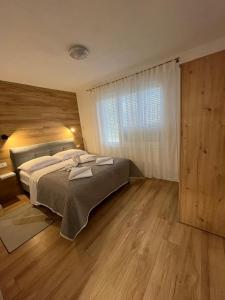 Postel nebo postele na pokoji v ubytování Apartman TeNeN