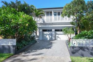 a large white house with trees and a driveway at Freshwater Villa - Seconds to the Beach in Freshwater