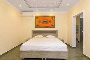 Кровать или кровати в номере amber Villas - Fahari Residence +16 фотографий