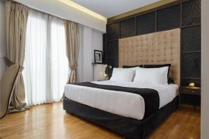 Posteľ alebo postele v izbe v ubytovaní Acropolis Unique Residence