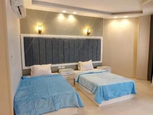 Säng eller sängar i ett rum på Black Prince Resort