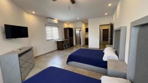 Ένα ή περισσότερα κρεβάτια σε δωμάτιο στο Hotel Plazuela