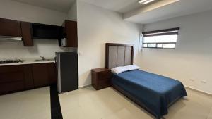 Ένα ή περισσότερα κρεβάτια σε δωμάτιο στο Hotel Plazuela