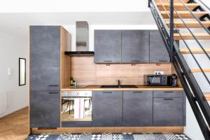 Kuchyňa alebo kuchynka v ubytovaní Duplex Standing - Hyper Centre - Tout équipé