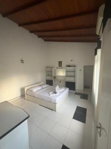Postel nebo postele na pokoji v ubytování Kande Home