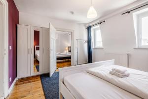 Postel nebo postele na pokoji v ubytování Old Town Center Apartments