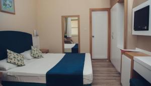 Postel nebo postele na pokoji v ubytování L'ancora Beach Hotel