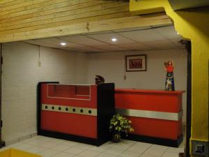 a waiting room with a lego food truck at Hotel Caleta in San Miguel