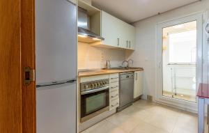 a kitchen with a refrigerator and a sink at Awesome Apartment In Torre-Pacheco in Torre-Pacheco