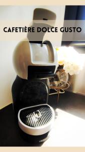 a coffee maker sitting on top of a table at Villa ETANG CIEL *Grande Terrasse*Clim*Parking in Le Soler