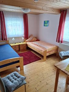 Postel nebo postele na pokoji v ubytování Gästehaus Rüger