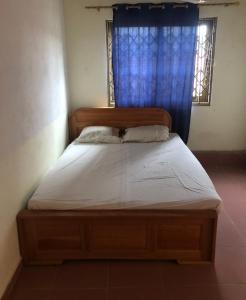 Łóżko lub łóżka w pokoju w obiekcie Kin Nkechi’s Residence