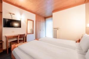 Postel nebo postele na pokoji v ubytování Hotel Grohmann