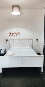 Postel nebo postele na pokoji v ubytování camera colombo 12 Genova Rooms
