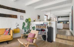 a living room with a couch and a table at Pet Friendly Home In Eg With Wifi in Egå