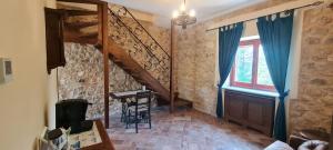 a living room with a staircase and a window at Villa Visocchi Bed and Breakfast in Atina