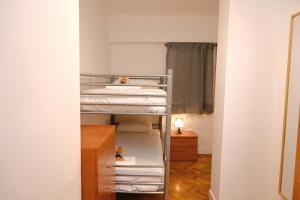 Ένα ή περισσότερα κρεβάτια σε δωμάτιο στο Homenfun Barcelona Eixample ll +6 φωτογραφίες