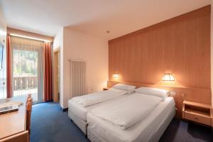 Postel nebo postele na pokoji v ubytování Hotel Grohmann