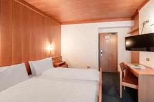 Postel nebo postele na pokoji v ubytování Hotel Grohmann