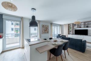 Et tv og/eller underholdning på Le cinquième ciel - 75m2 avec garage privé