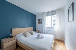 En eller flere senge i et værelse på Le cinquième ciel - 75m2 avec garage privé