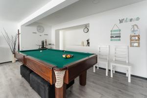 a billiard room with a pool table in it at GuestReady - Amazing holiday home near the beach in Vila Nova de Gaia