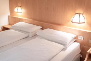 Postel nebo postele na pokoji v ubytování Hotel Grohmann