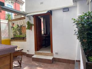 an open door of a house with a porch at La Casa di Apollo in Naples