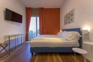 Voodi või voodid majutusasutuse Hotel Paradiso Conca d'Oro toas