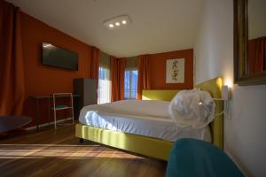 Voodi või voodid majutusasutuse Hotel Paradiso Conca d'Oro toas