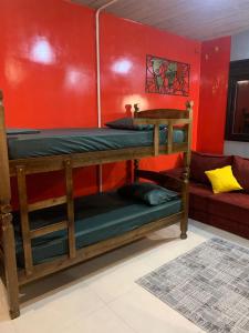 a room with two bunk beds and a couch at Templos, Brás, Expo Center Norte, Anhembi, 25 in Sao Paulo