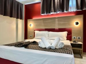 Postel nebo postele na pokoji v ubytování Hotel Giacosa
