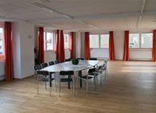 a large room with a table and chairs in it at Sefano Nossen in Nossen