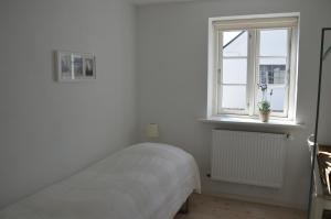 Кровать или кровати в номере Svendlundgaard Apartments