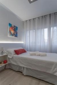 Postel nebo postele na pokoji v ubytování Hotel Gabriel y Galán