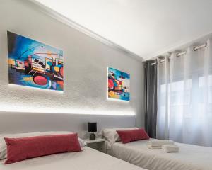 Postel nebo postele na pokoji v ubytování Hotel Gabriel y Galán