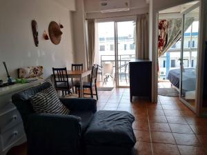 a living room with a couch and a table at Avatara B condominium B54 in Ban Tha Fat