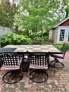 a patio table with two chairs and a table with at Vintage Charm: Annapolis Retreat in Annapolis