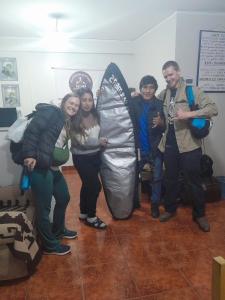 a group of people posing for a picture in a large inflatable at Yerupaja Mountain Hostel in Huaraz