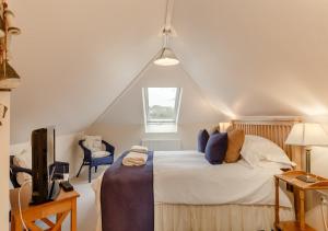 Un pat sau paturi într-o cameră la Quillets 13