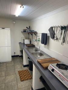 a kitchen with a sink and a counter top at Lemberg Wine Estate in Tulbagh