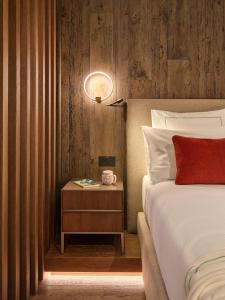 En eller flere senge i et værelse på Collina Luxury Relais