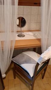 Postel nebo postele na pokoji v ubytování Al NIDO DELLE RONDINI + 4 fotografie