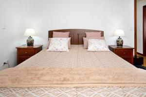 En eller flere senge i et værelse på Casa da Cândida