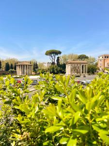 a view of a parking lot with buildings in the background at Velabro Luxury Loft in Rome